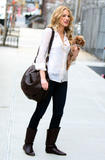Blake Lively with her dog Penny leaving the set of 