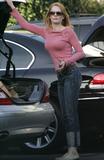 Marg Helgenberger in jeans and pink top shopping candids in Santa Monica